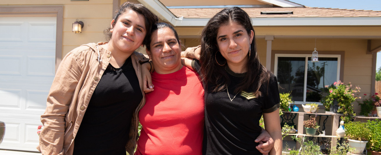 Homeowner Sandra Gonzalez with her daughters Abigail, 13, and Aurora, 17.