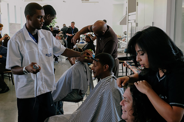 Students from a local beauty college spend a day giving residents haircuts and styling, manicures and pedicures.